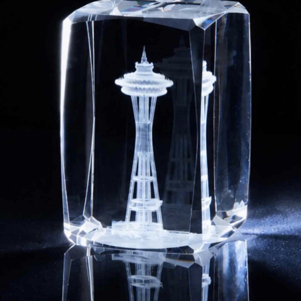 Beveled rectangular crystal with a 3D etched tower inside